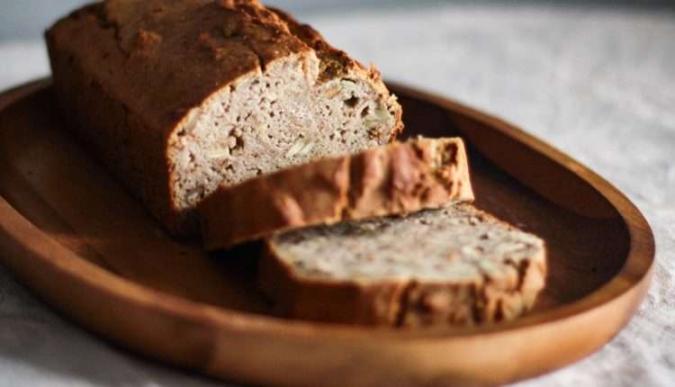 close up photo of sliced bread on oval wooden plate
